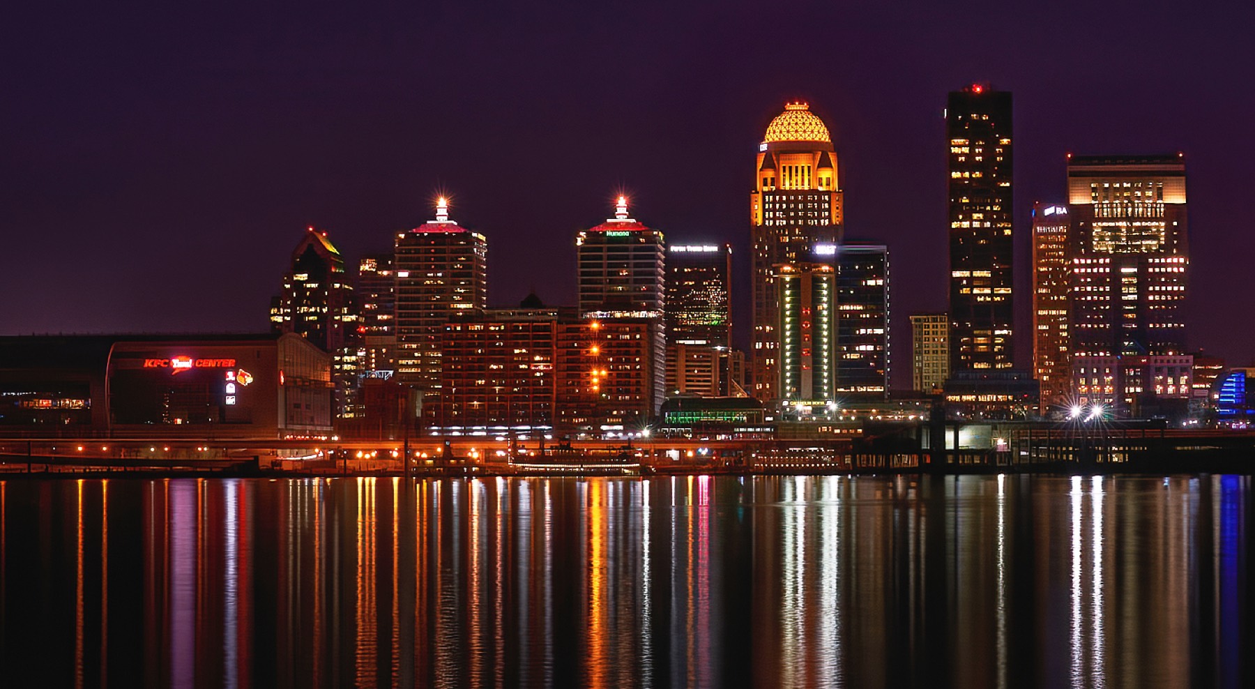 The Louisville skyline along the Ohio River at dusk